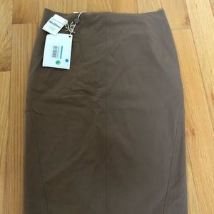 Skirt knee length, runs small